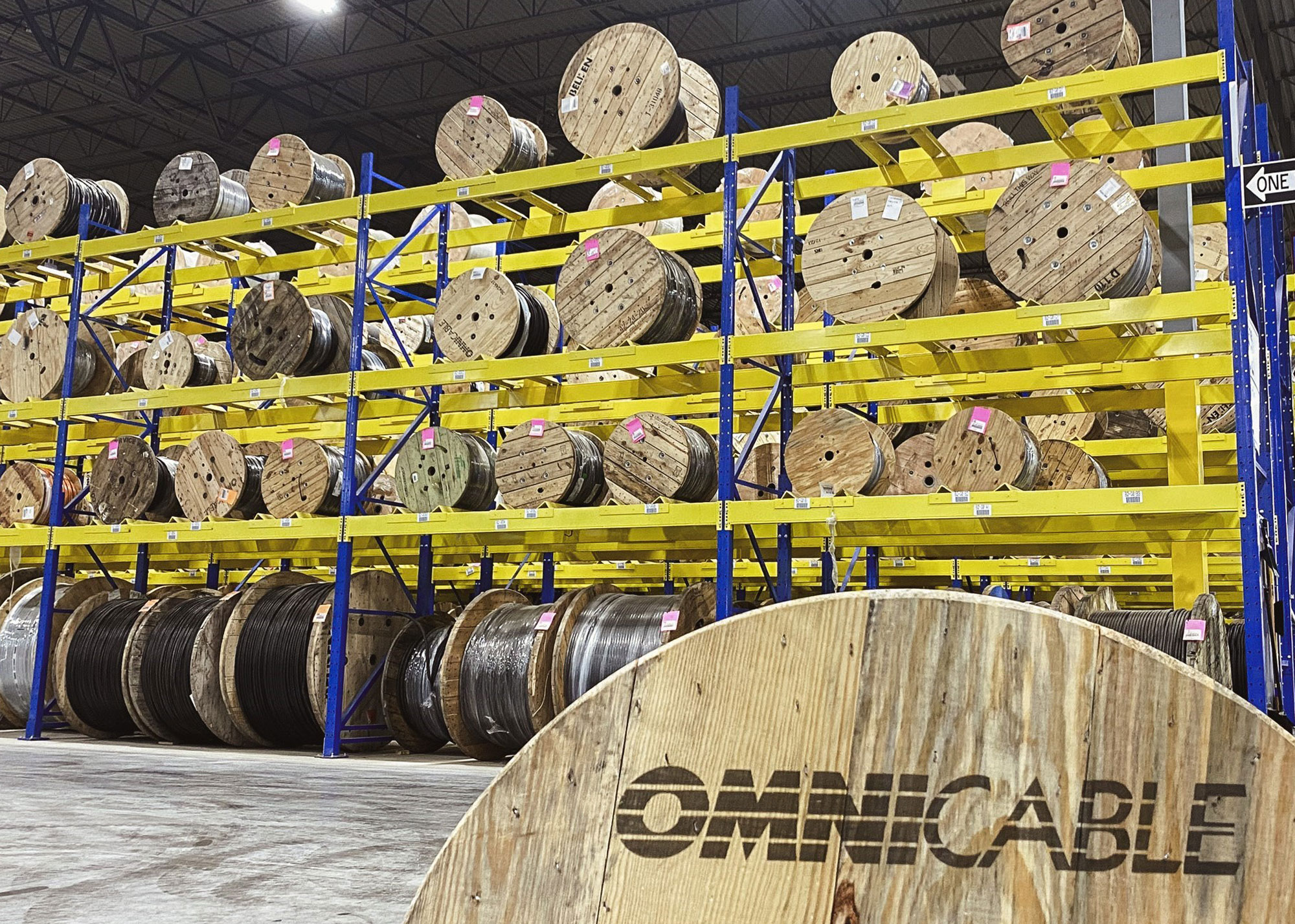 Up close view of an OmniCable labeled reel in a warehouse